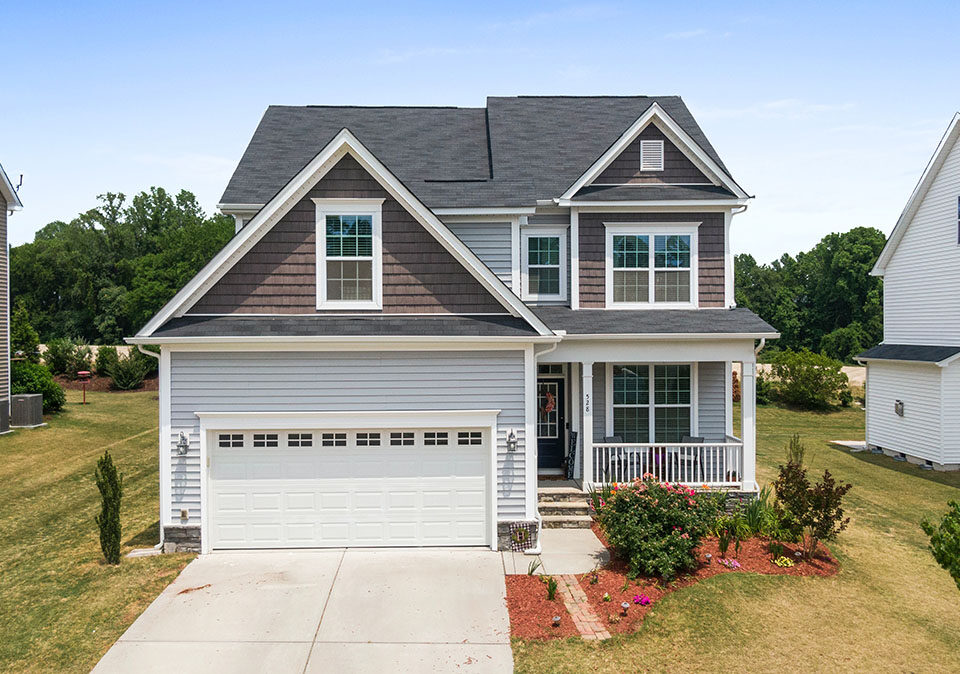 Curb Appeal: Why Making A Great First Impression Is Important 12 Suburban house with landscaping and curb appeal
